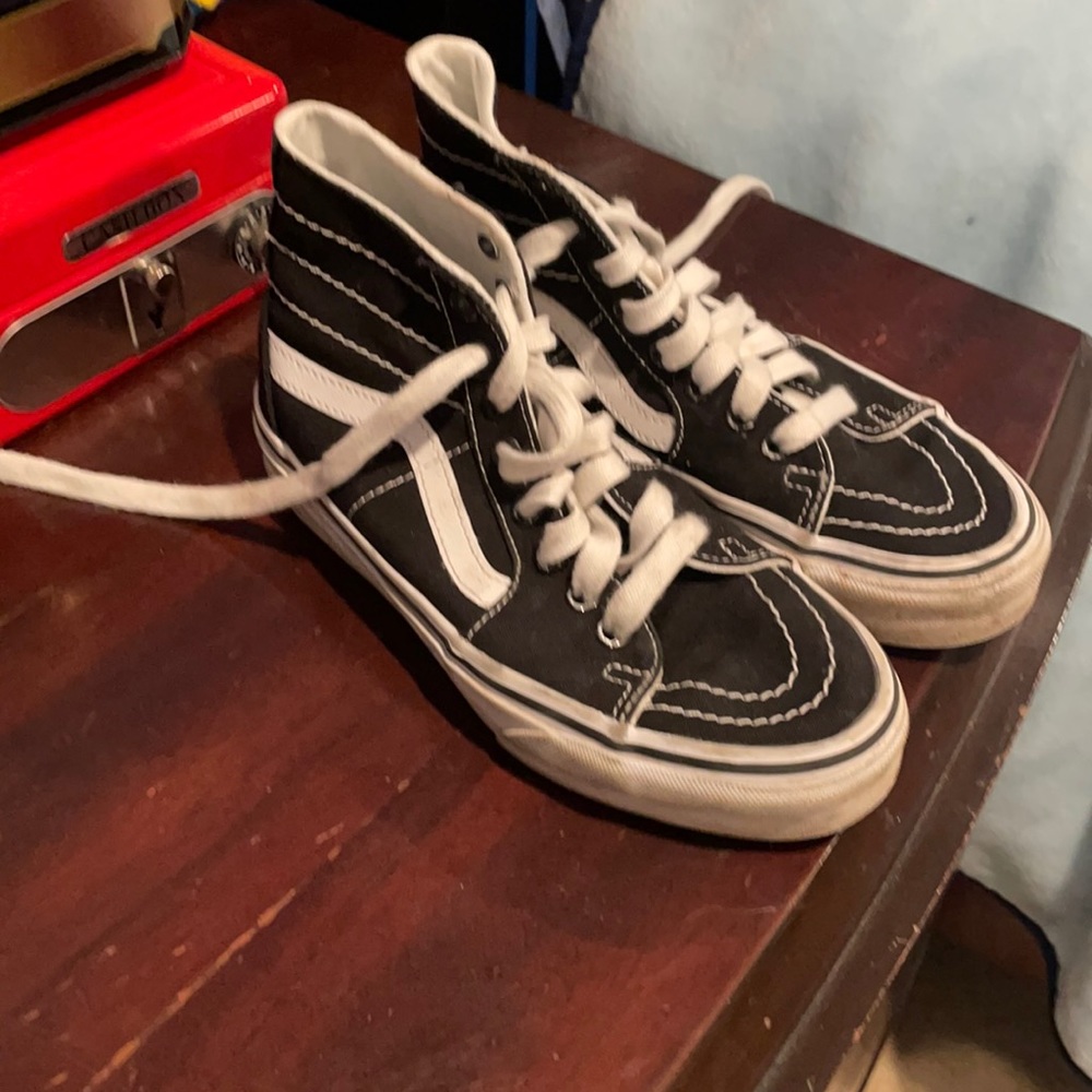 Black and white vans high top shoes